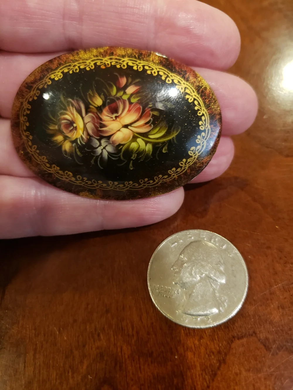 Vintage '96 Oval Black Floral Brooch with Gold Accents
